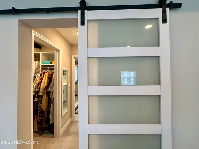 a living room with furniture gym equipment and a window