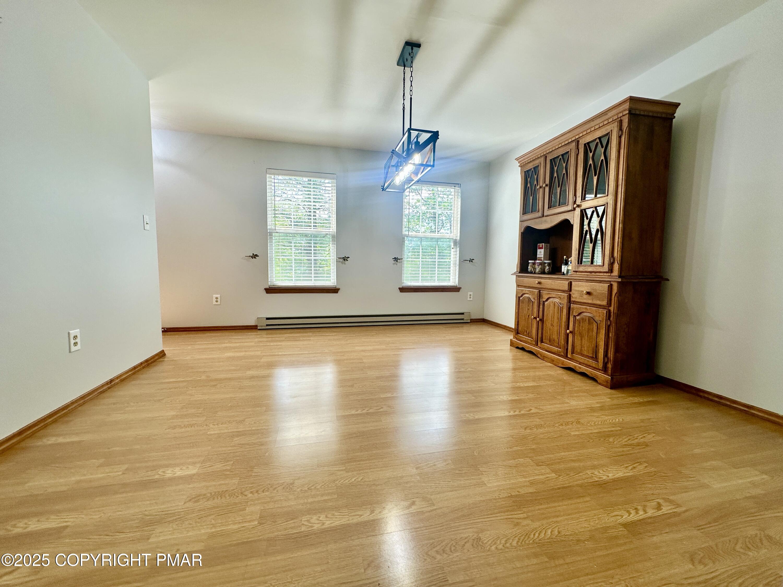 164 Alpine Road Henryville, PA 18332 - Photo 13 of 49 a view of an empty room with window and kitchen view