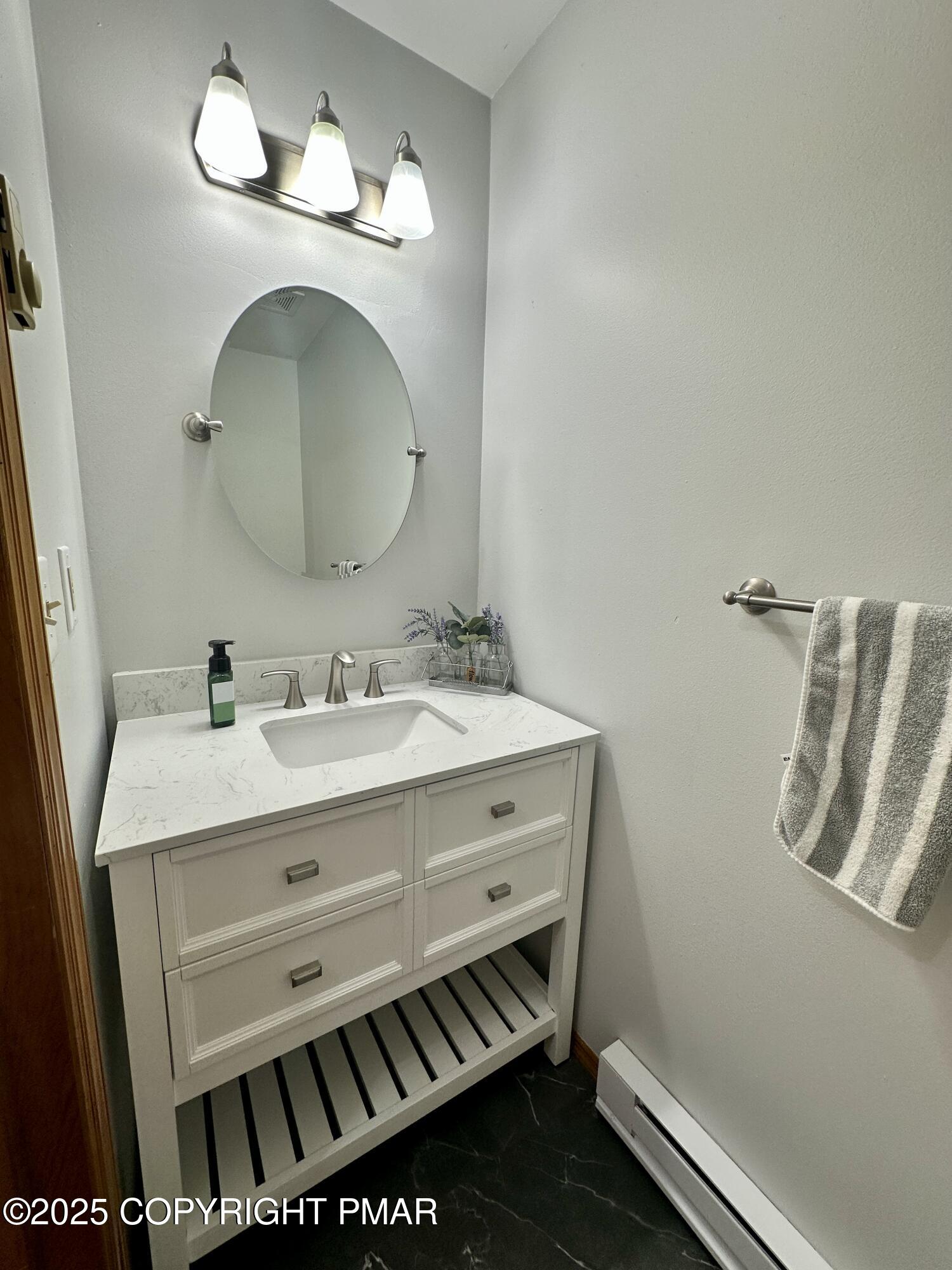 164 Alpine Road Henryville, PA 18332 - Photo 27 of 49 a bathroom with a sink and a mirror
