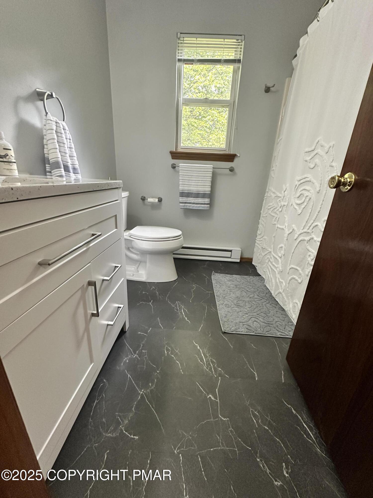 164 Alpine Road Henryville, PA 18332 - Photo 42 of 49 a bathroom with a toilet a sink and a mirror