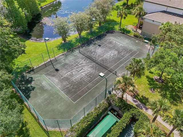 an aerial view of a house with garden space and a patio
