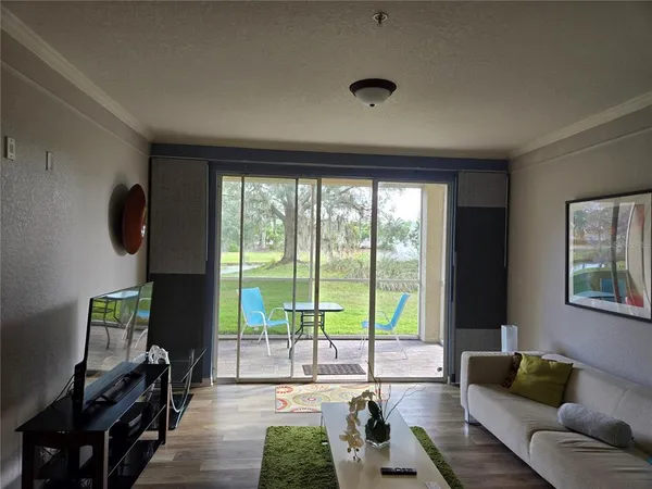 a living room with a couch and a rug