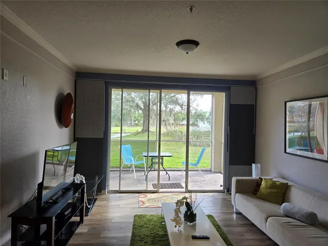 a living room with a couch and a rug