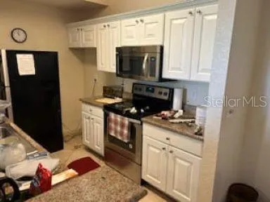 a bathroom with a toilet a sink and a mirror