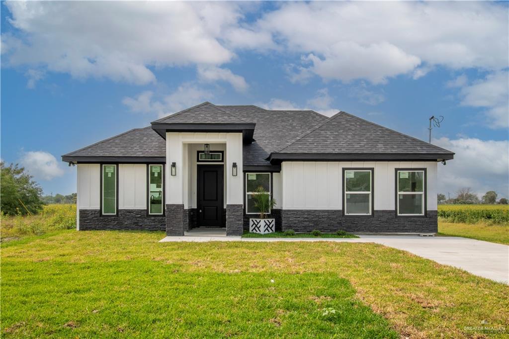 305 Santa Lorraine Santa Rosa, TX 78593 - Photo 1 of 1 View of front of house with a front yard