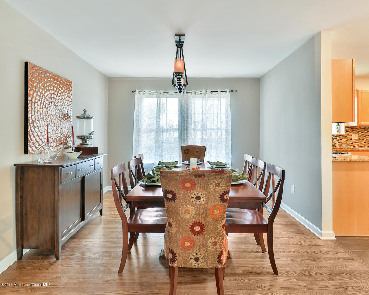 112 Seaspray Road Manahawkin, NJ 08050 - Photo 12 of 21 a view of a dining room with furniture window and wooden floor