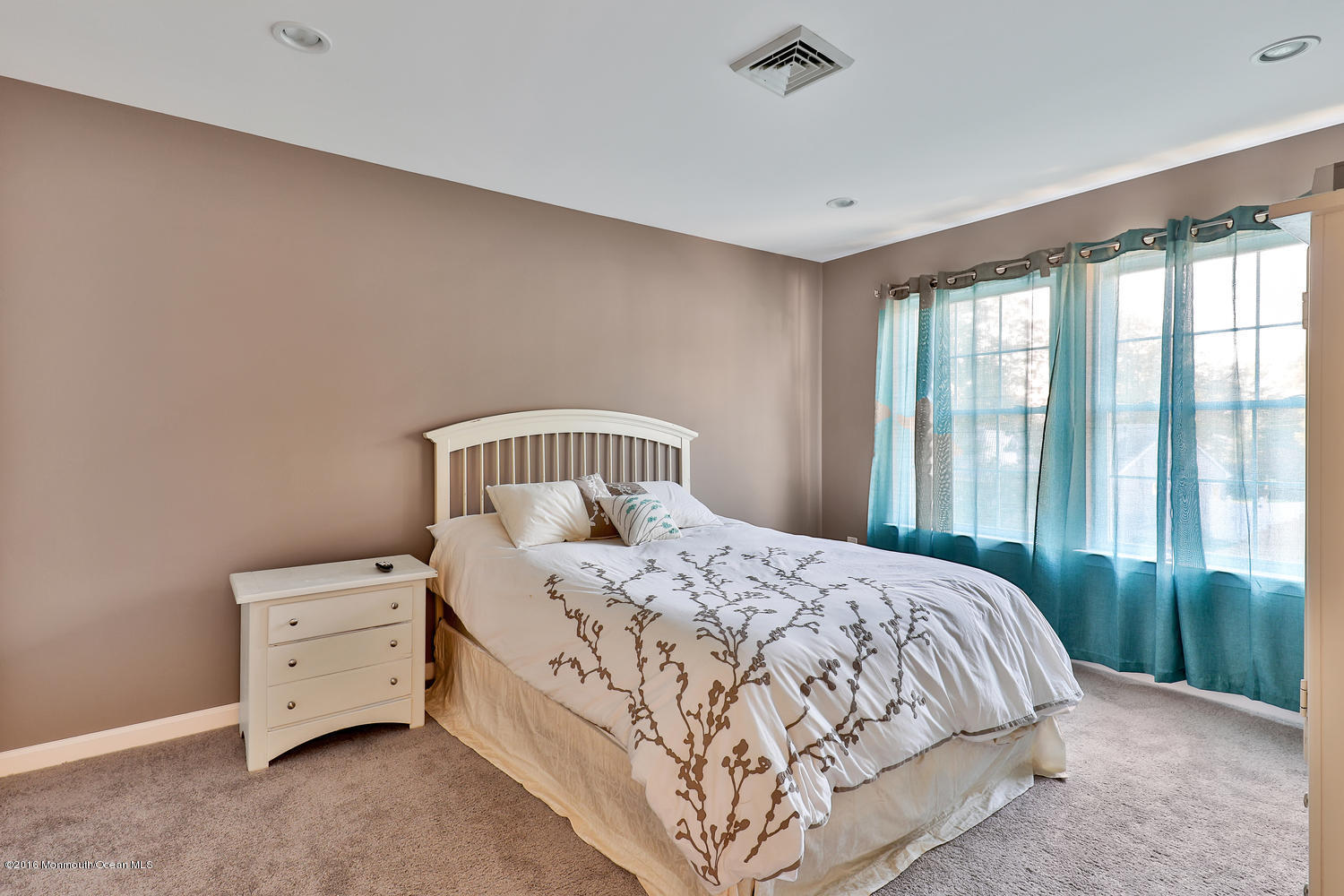 112 Seaspray Road Manahawkin, NJ 08050 - Photo 18 of 21 a bedroom with a bed and a window