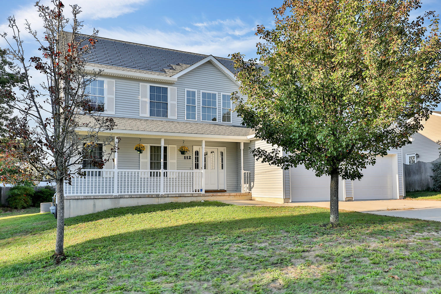 112 Seaspray Road Manahawkin, NJ 08050 - Photo 2 of 21 a front view of a house with a yard
