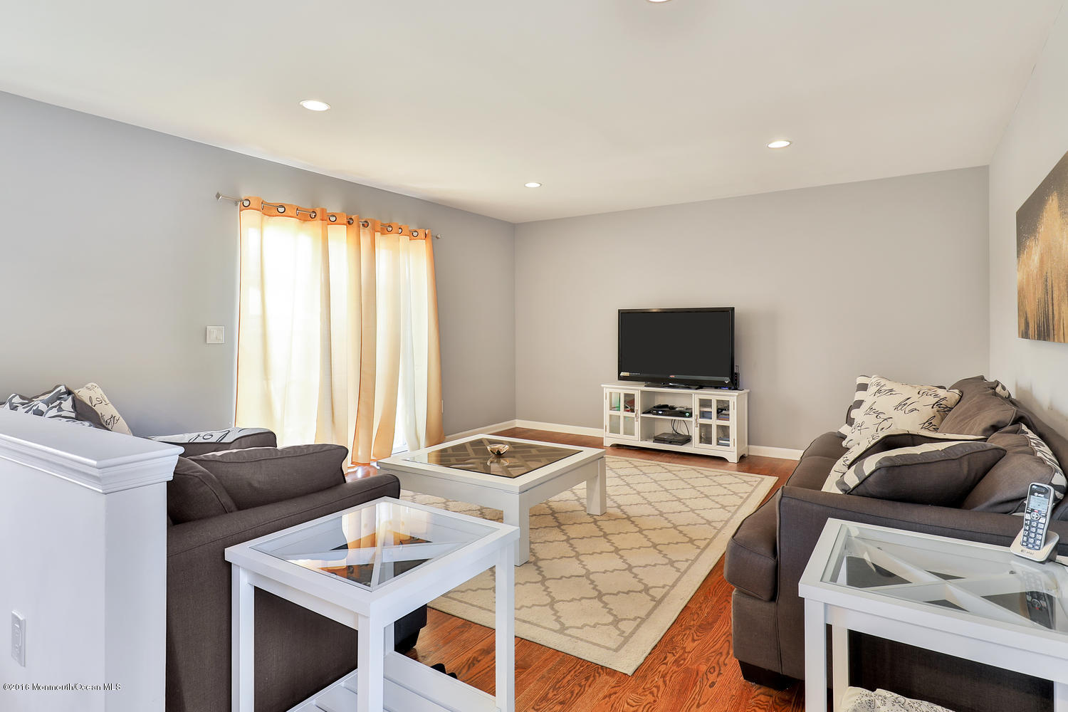 112 Seaspray Road Manahawkin, NJ 08050 - Photo 7 of 21 a living room with furniture and a flat screen tv