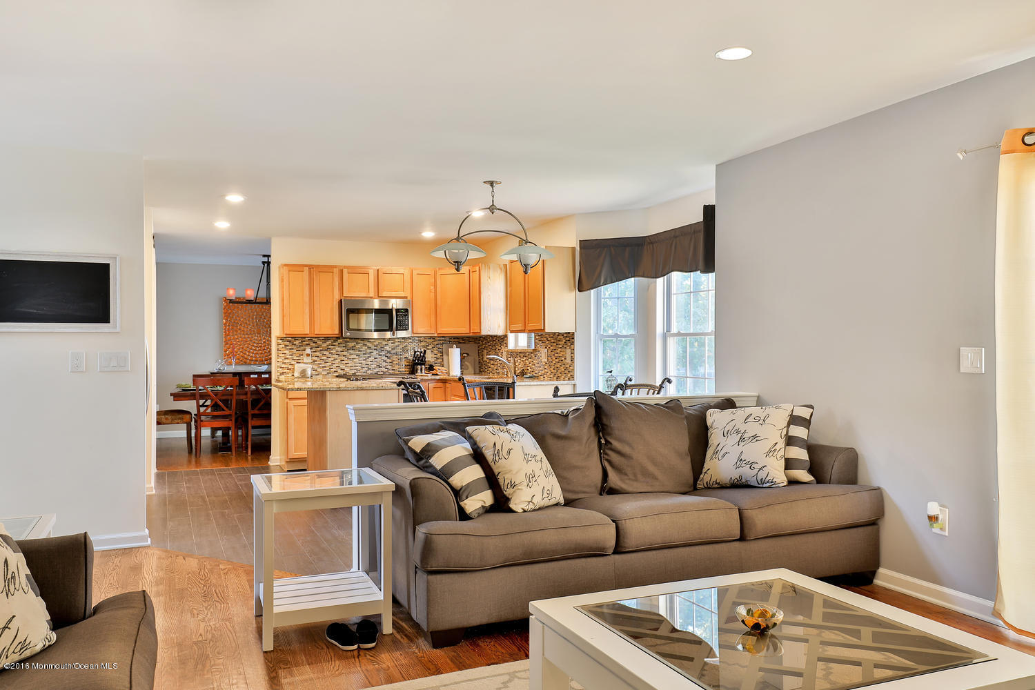 112 Seaspray Road Manahawkin, NJ 08050 - Photo 8 of 21 a view of kitchen with dining table and chairs