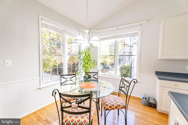a view of a dining room with furniture water view and balcony
