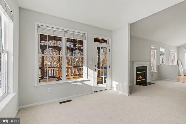 a view of a swimming pool with an outdoor space and seating area