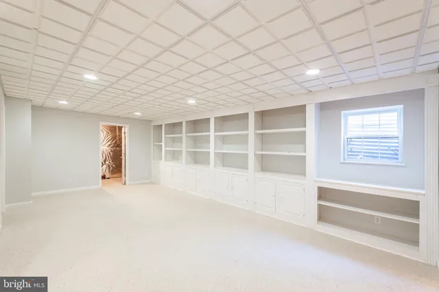 a view of a swimming pool with an outdoor space and seating area