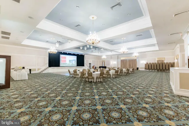 a dining area with furniture and view kitchen