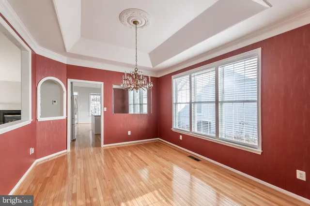 a kitchen with sink cabinets and wooden floor