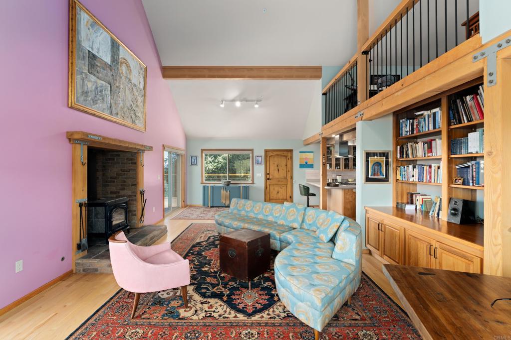 25770 East Grade Road Santa Ysabel, CA 92070 - Photo 5 of 75 a living room with furniture and a book shelf