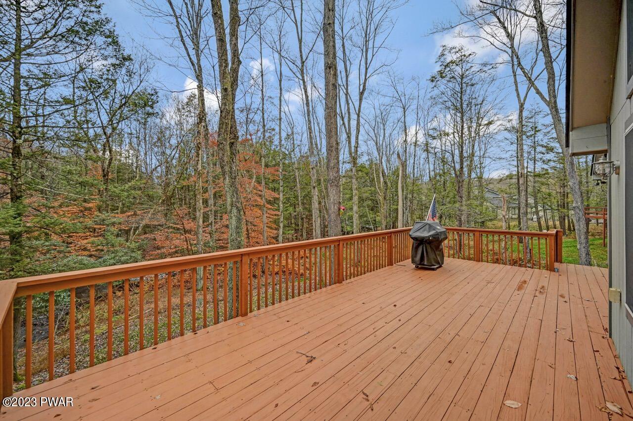 1294 Brookfield Road Lake Ariel, PA 18436 - Photo 7 of 75 a view of a balcony with wooden floor and fence