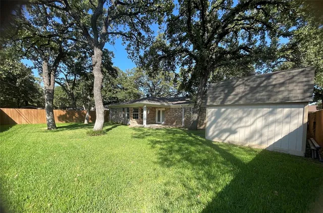 a view of a backyard with garden