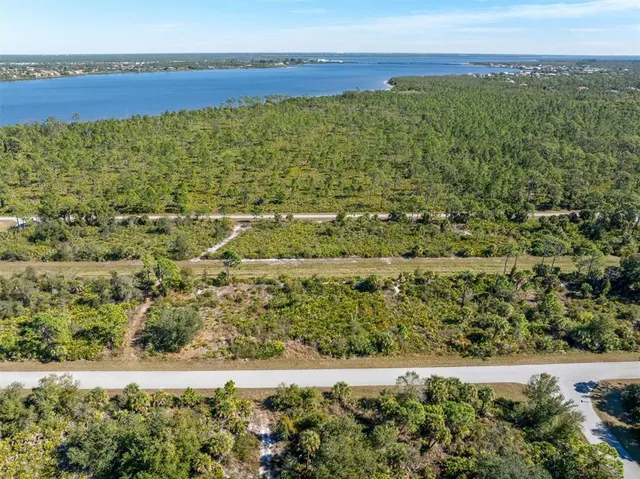 a view of a field with an ocean