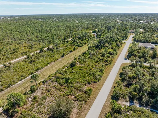 a view of a yard with an outdoor seating