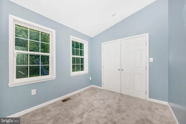 a view of empty room with windows