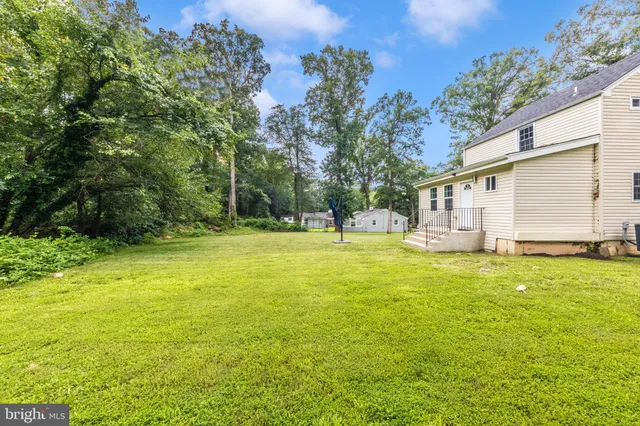 a view of a swimming pool with an outdoor space and seating area