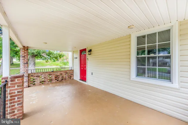 a view of an empty room with a balcony and balcony