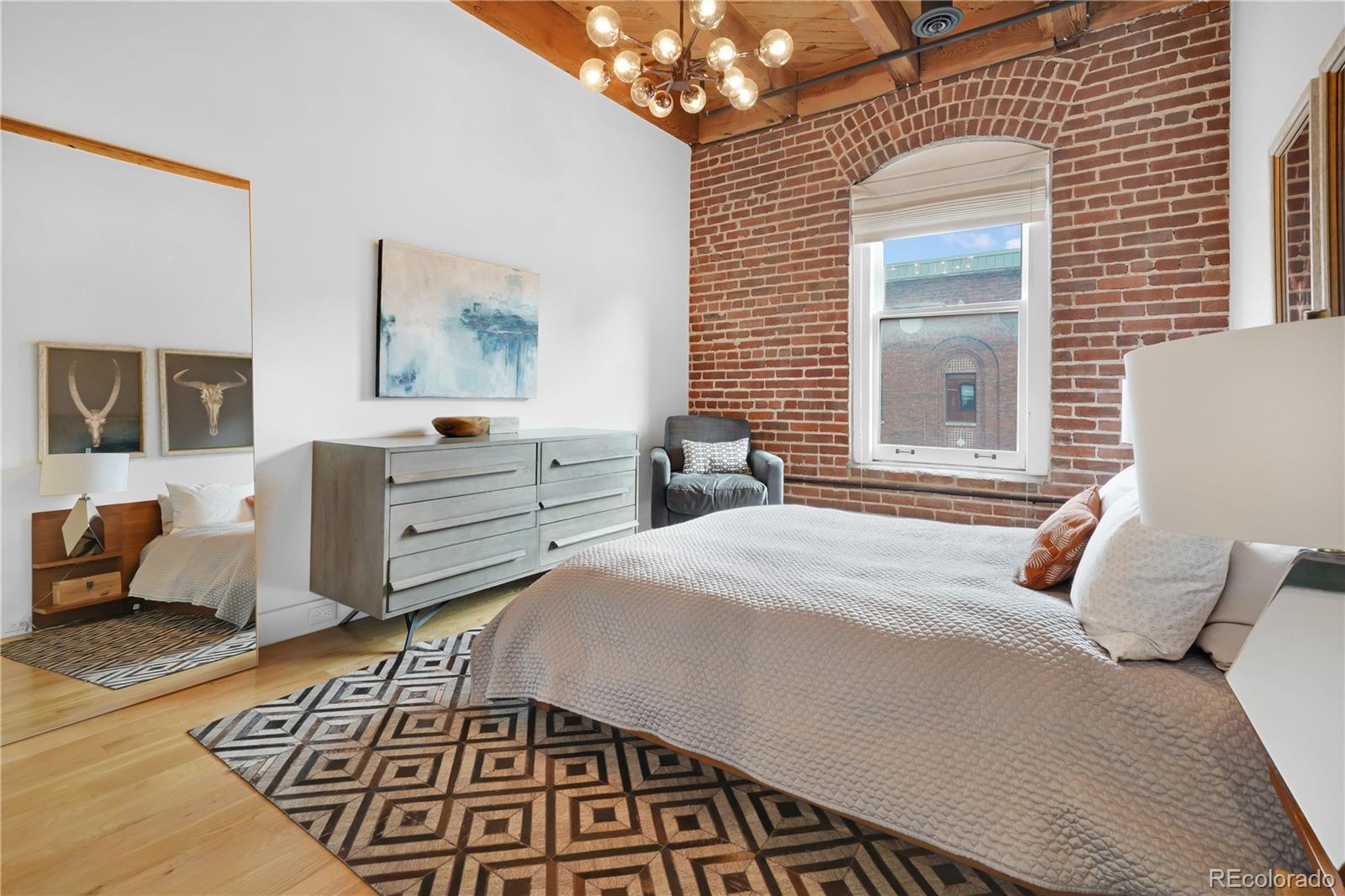 1792 Wynkoop Street, Unit 307 Denver, CO 80202 - Photo 13 of 26 a bedroom with bed and window