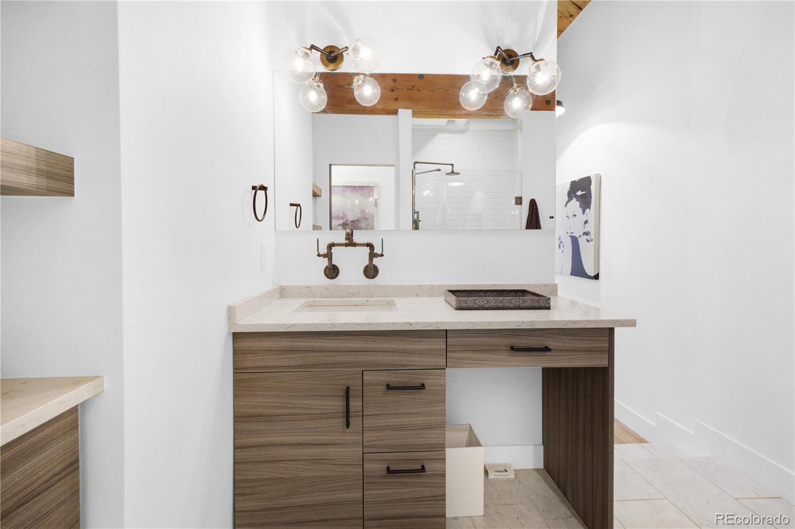 1792 Wynkoop Street, Unit 307 Denver, CO 80202 - Photo 15 of 26 a bathroom with a sink and a mirror