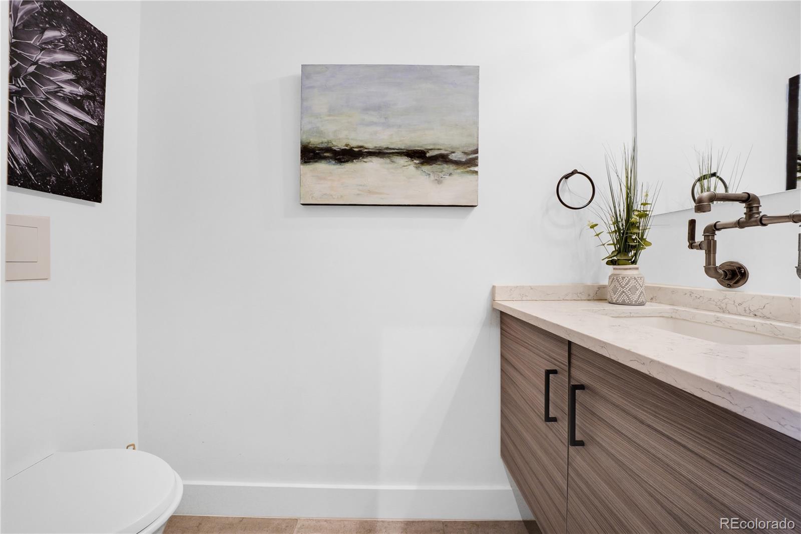 1792 Wynkoop Street, Unit 307 Denver, CO 80202 - Photo 18 of 26 a bathroom with a sink and a mirror