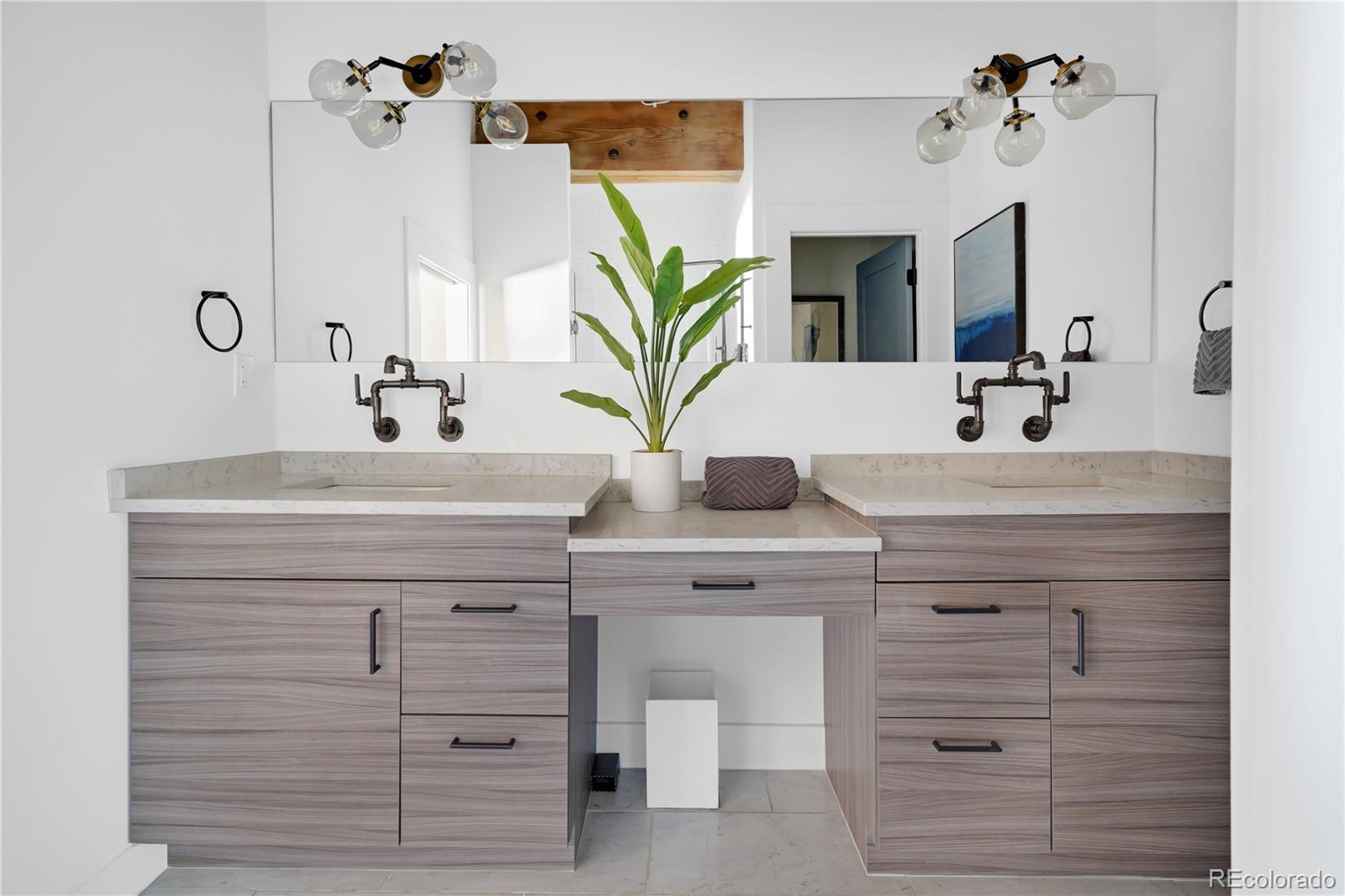 1792 Wynkoop Street, Unit 307 Denver, CO 80202 - Photo 10 of 26 a bathroom with a sink vanity granite and a mirror