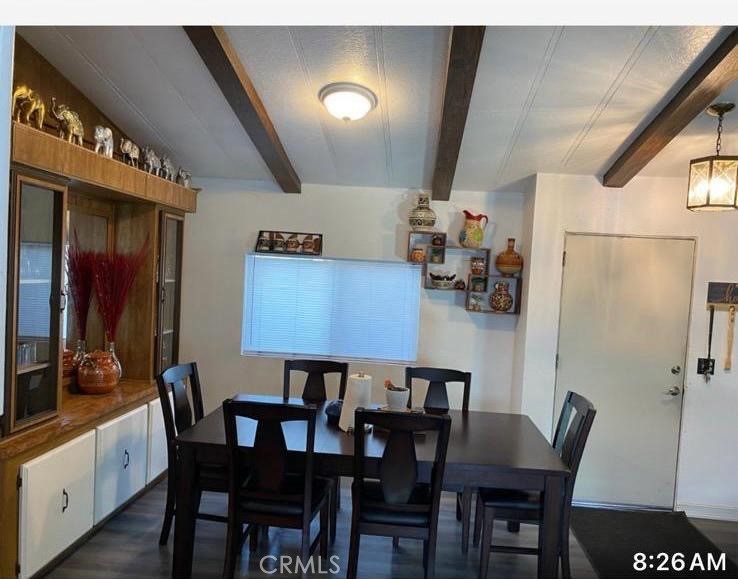 499 Pacheco Road, Unit 214 Bakersfield, CA 93307 - Photo 5 of 8 a view of a dining room with furniture