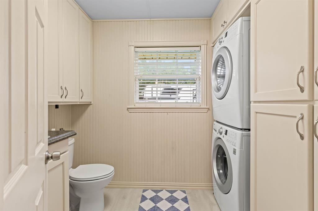 934 North Maple Street Muenster, TX 76252 - Photo 11 of 39 a white toilet sitting next to a bathroom sink