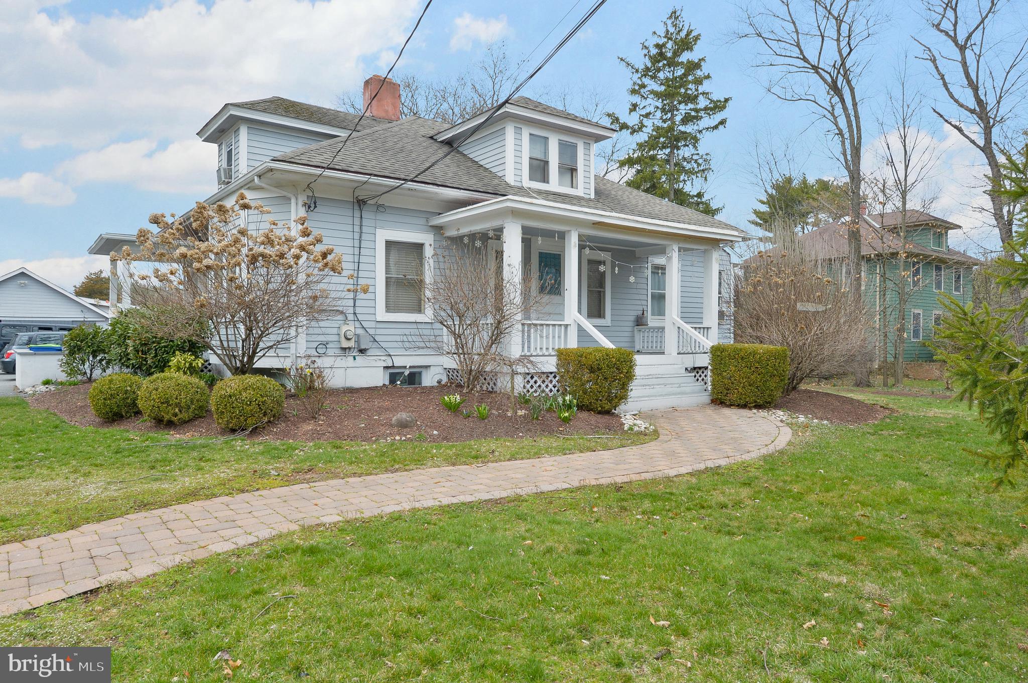 922 Route 601 Skillman Nj 08558 Skillman, NJ 08558 - Photo 2 of 59 a front view of a house with a garden and plants