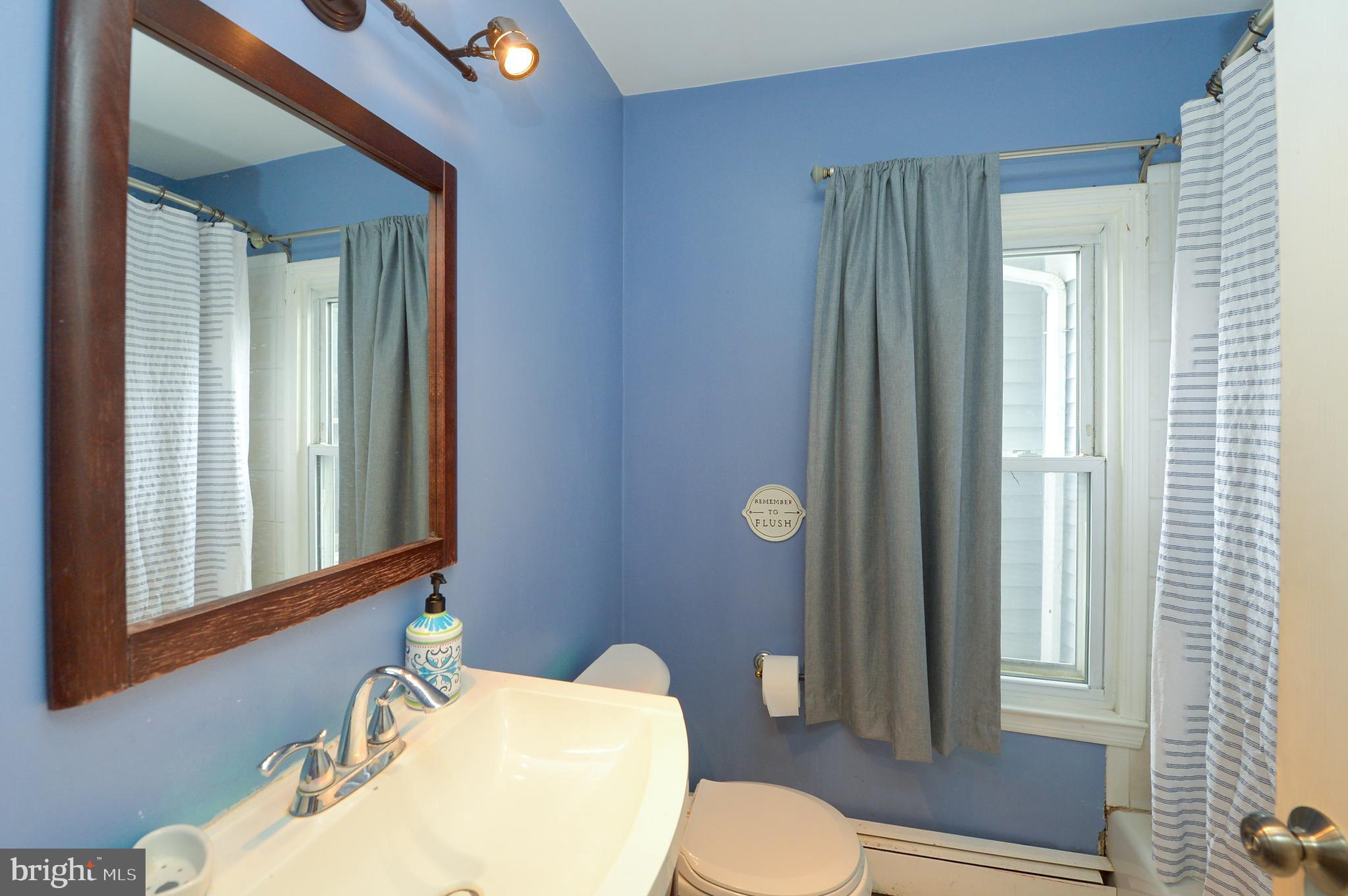 922 Route 601 Skillman Nj 08558 Skillman, NJ 08558 - Photo 21 of 59 a bathroom with a sink mirror vanity and toilet