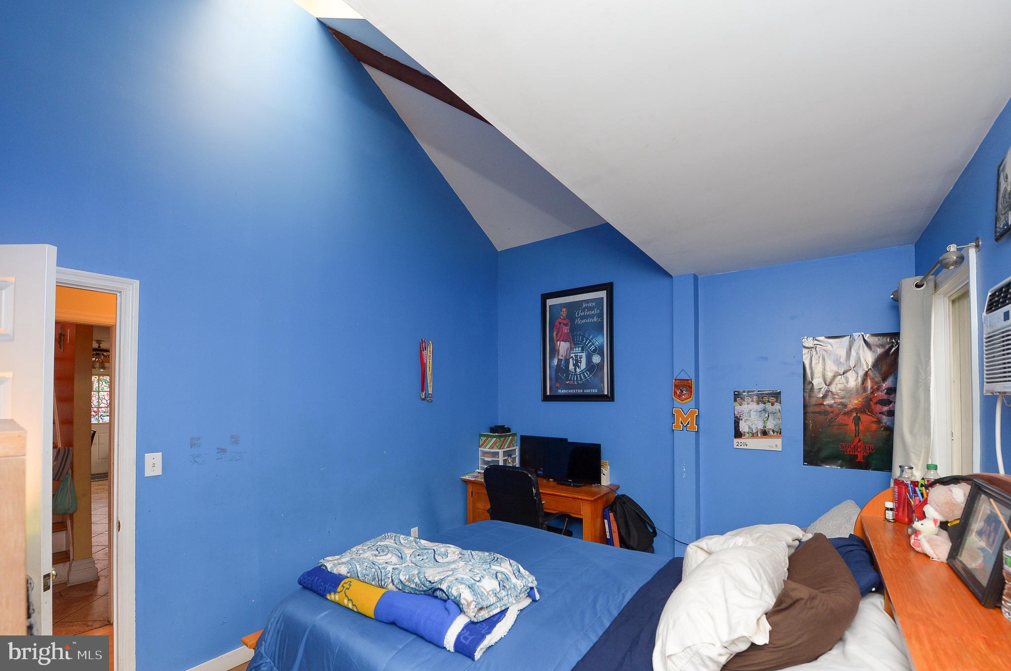 922 Route 601 Skillman Nj 08558 Skillman, NJ 08558 - Photo 25 of 59 a living room with furniture and a flat screen tv