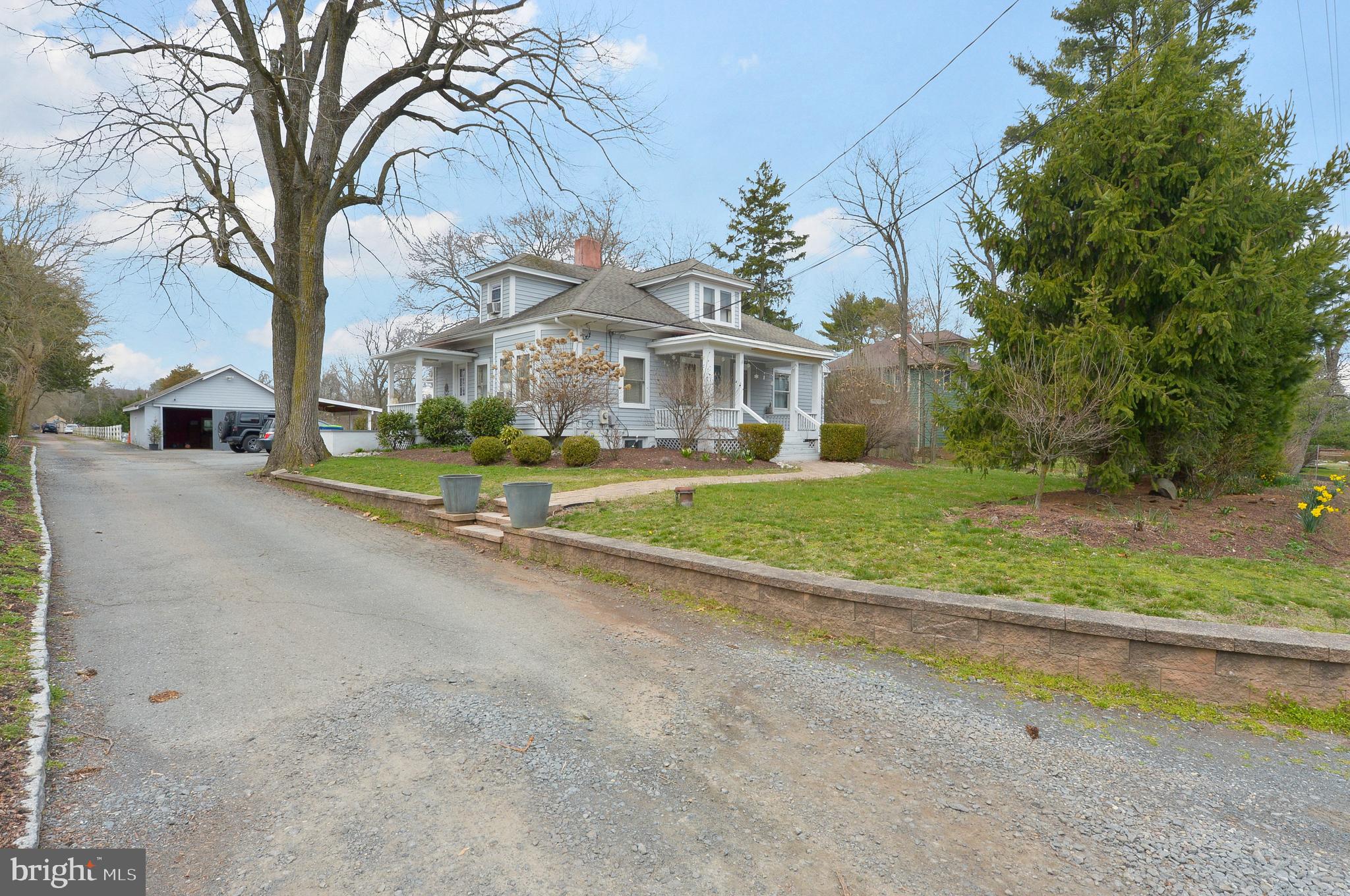 922 Route 601 Skillman Nj 08558 Skillman, NJ 08558 - Photo 3 of 59 a view of a house with a big yard and large trees