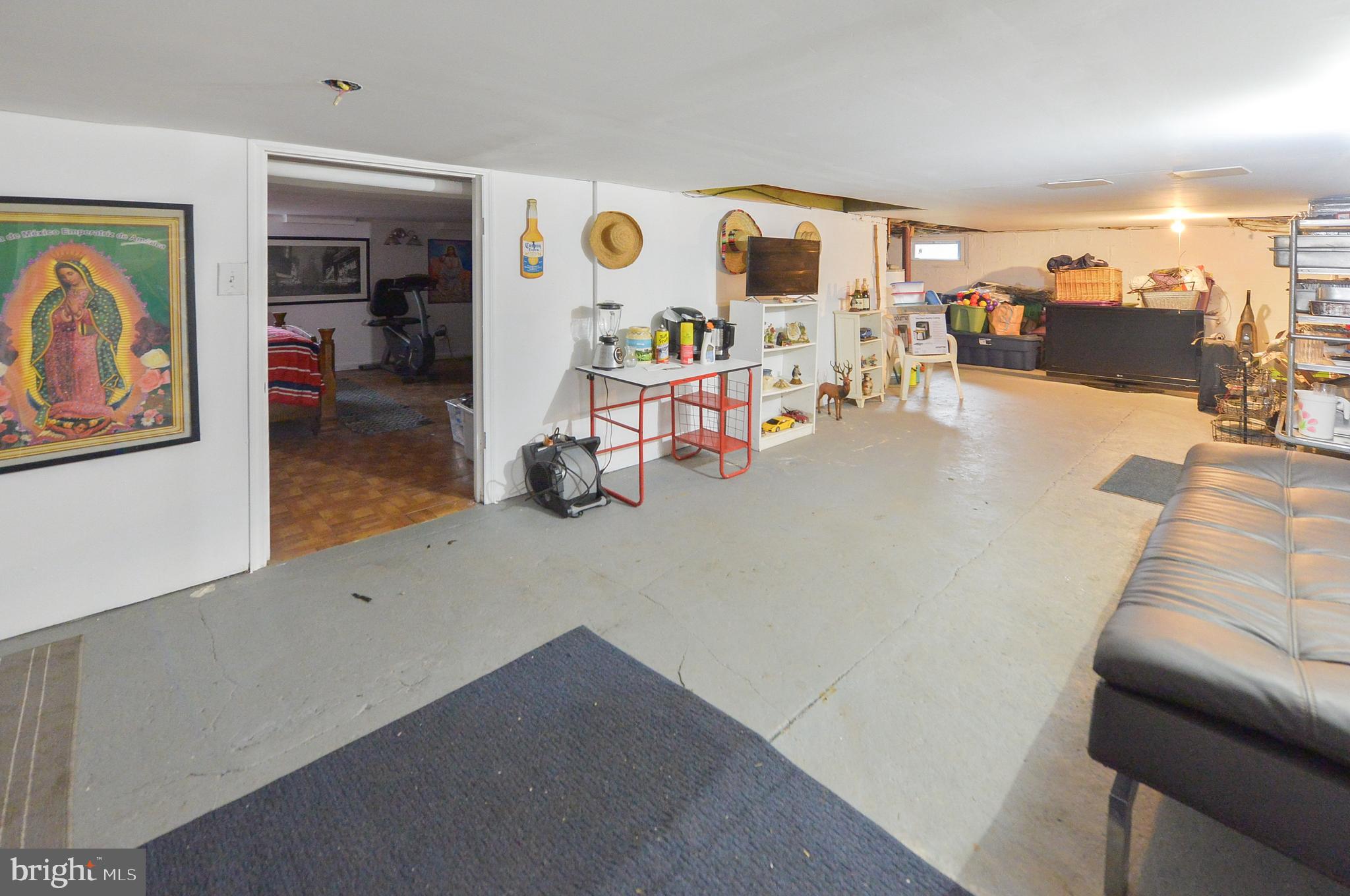 922 Route 601 Skillman Nj 08558 Skillman, NJ 08558 - Photo 35 of 59 a living room with furniture and a flat screen tv
