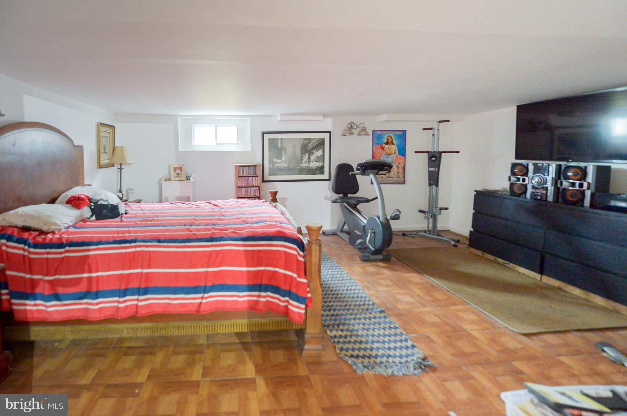 922 Route 601 Skillman Nj 08558 Skillman, NJ 08558 - Photo 36 of 59 a bedroom with a bed and wooden floor