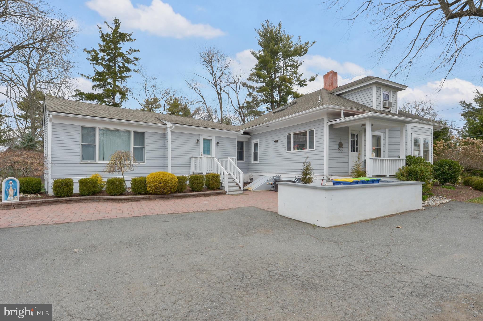 922 Route 601 Skillman Nj 08558 Skillman, NJ 08558 - Photo 4 of 59 a front view of house with yard and trees in the background