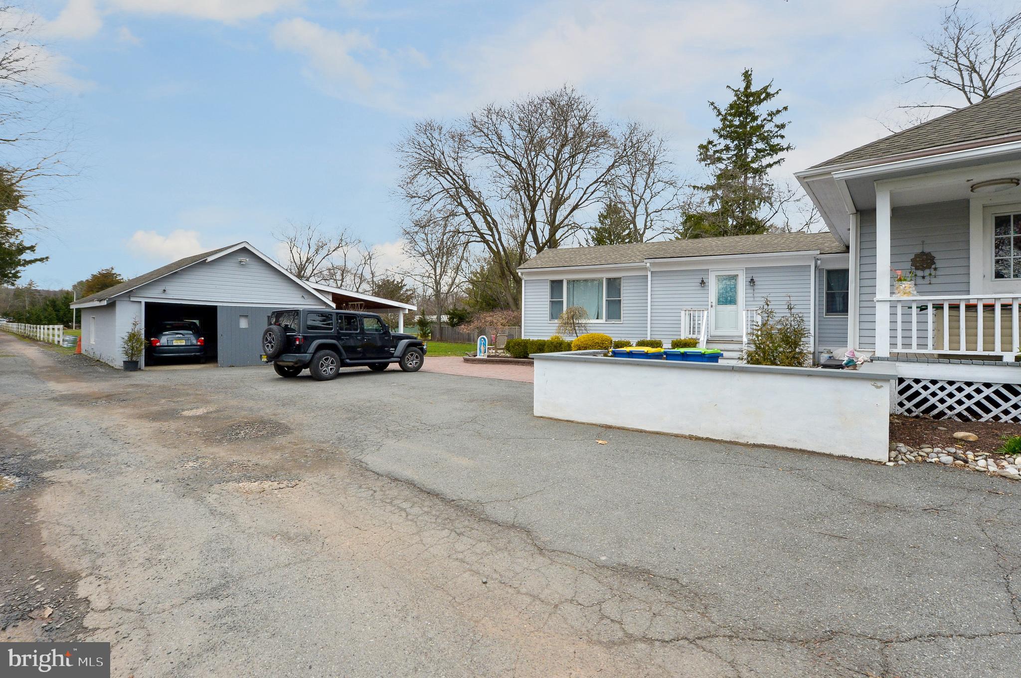 922 Route 601 Skillman Nj 08558 Skillman, NJ 08558 - Photo 5 of 59 a view of house with outdoor space and tall tree