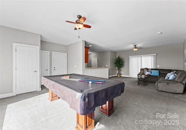 a dinning room with furniture and window