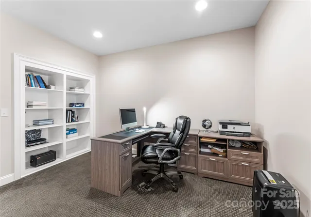 a view of a workspace with furniture