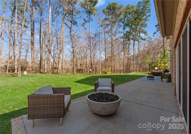 a view of a garden with an outdoor seating