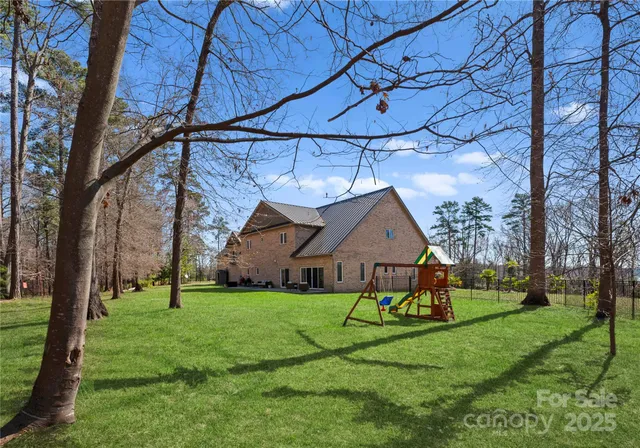 a view of a house with a big yard