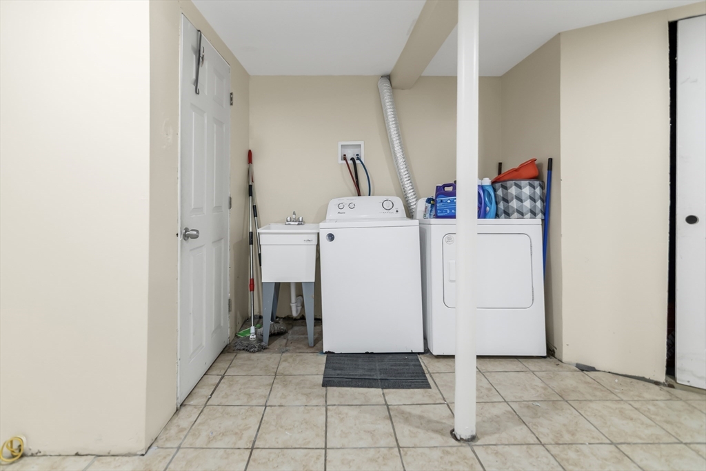 191 Farnham Street Lawrence, MA 01843 - Photo 18 of 31 a utility room with dryer and washer