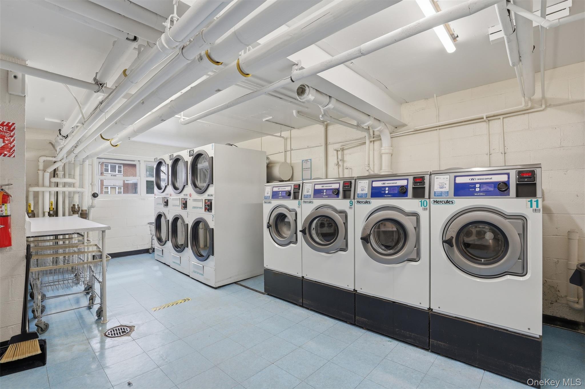 667 Pelham Road, Unit B10 New Rochelle, NY 10805 - Photo 12 of 16 a utility room with dryer and washer