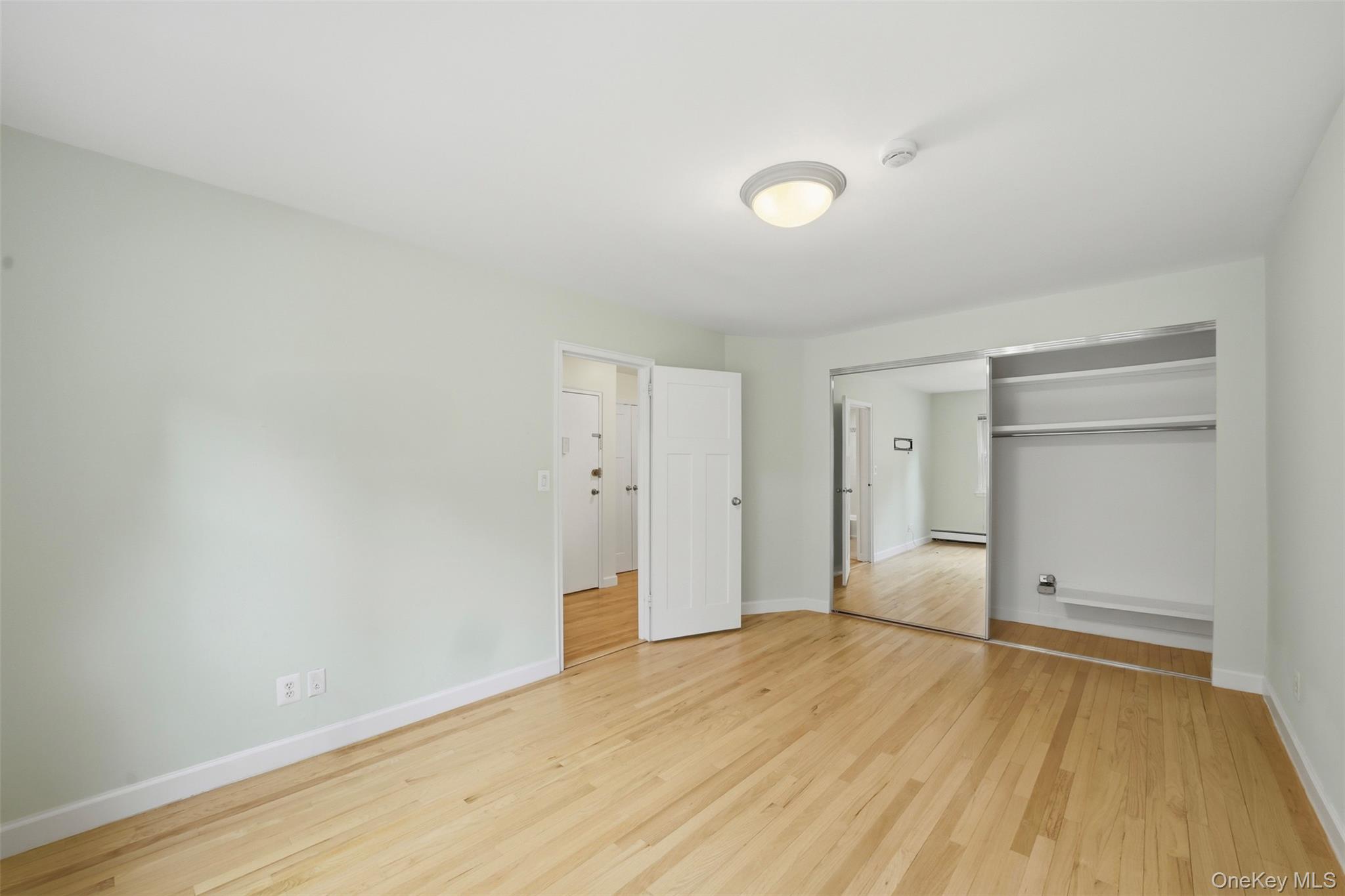 667 Pelham Road, Unit B10 New Rochelle, NY 10805 - Photo 6 of 16 wooden floor in an empty room