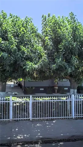 a view of a chair and tables in the patio