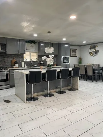 a kitchen with lots of counter top space appliances and cabinets